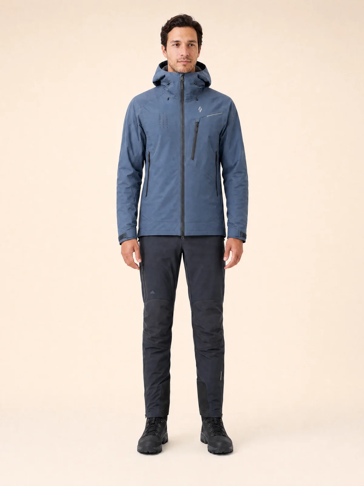 Full-body on-model image of a technical jacket against a clean studio backdrop